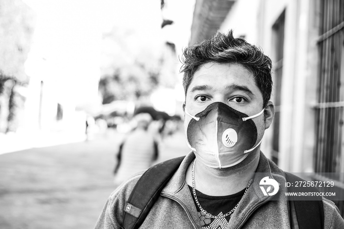 Close-up portrait of his he nice cheerful bearded guy wearing breathing mask checked shirt IT expert