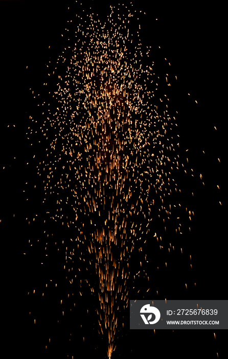 colorful fountain fireworks stream into dark night