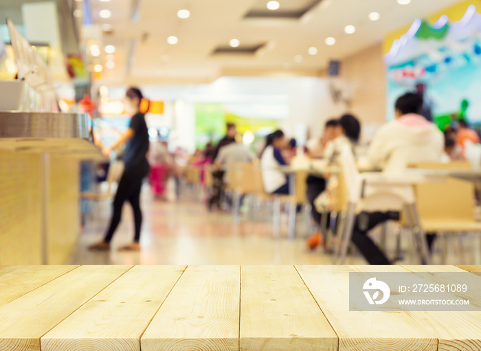 Food court or foodcourt interior blurred background. Restaurant or canteen with table, people at ind