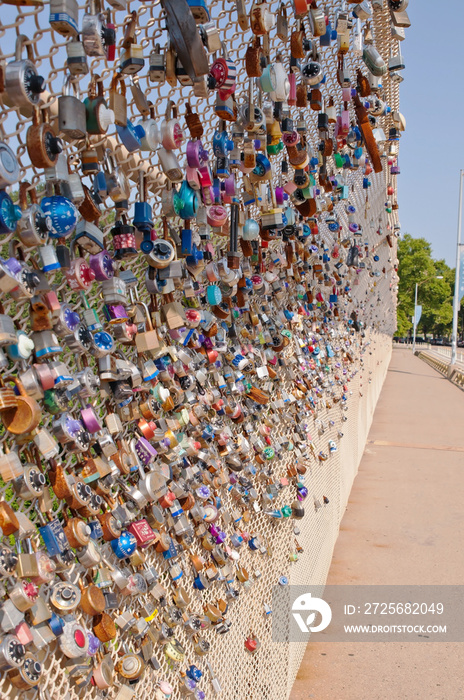 Locks signifying a couples love for one another on a bridges chain fence in Pittsburgh, Pennsylvani