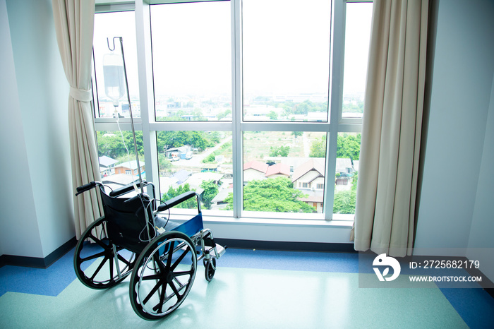 Wheelchairs in the hospital, Empty wheelchair stand near window at hospital