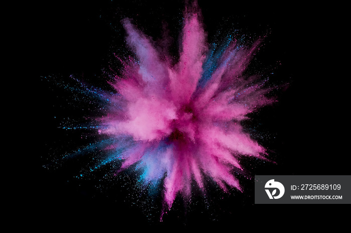 Colored powder explosion. Abstract closeup dust on backdrop. Colorful explode. Paint holi