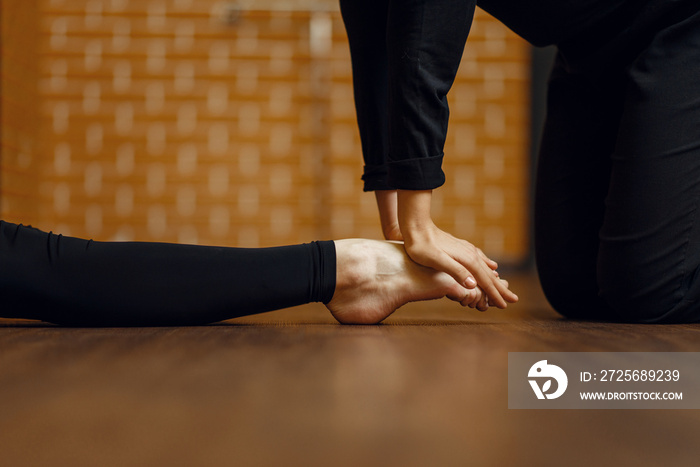 Contemporary dance performer, stretching on foot