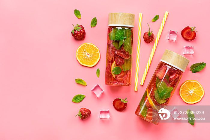 Strawberry infused water, cocktail, lemonade or tea. Summer iced cold drink with strawberry, lemon a