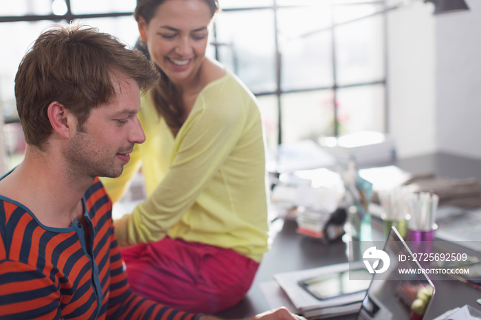 Couple working from home at laptop