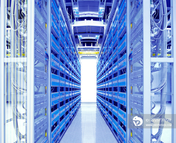 shot of network cables and servers in a technology data center