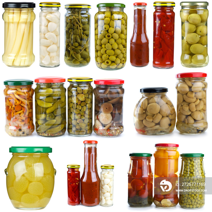 Set of different berries and vegetables conserved in glass jars