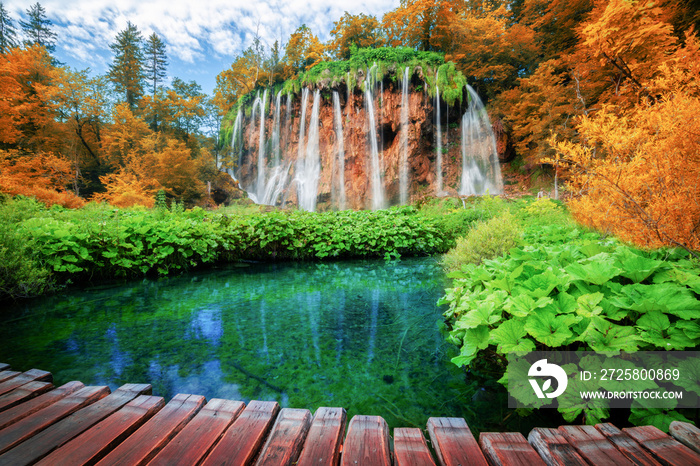 Beautiful wooden path trail for nature trekking with lakes and waterfall landscape in Plitvice Lakes