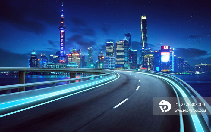 Highway overpass modern Shanghai city skyline background . Night scene .