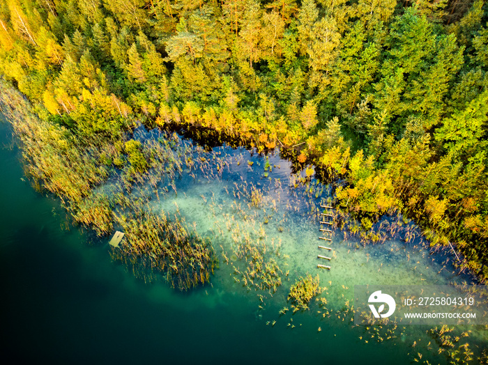 Aerial top down view of beautiful green waters of lake Gela. Birds eye view of scenic emerald lake s