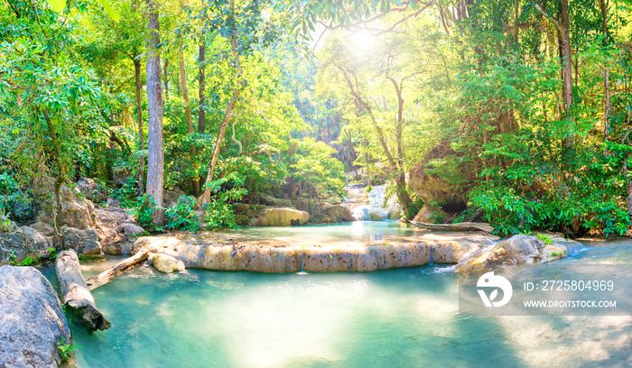 Tropical landscape with beautiful cascades of waterfall and green trees in wild jungle forest. Erawa