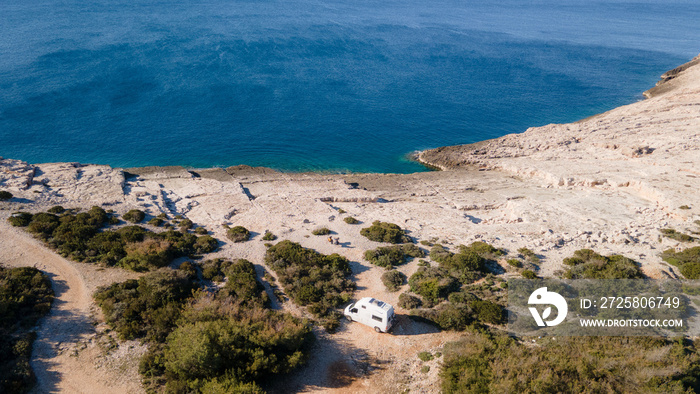 White camper, rv, motorhome standing at a beach camp spot, Vis Island, Croatia