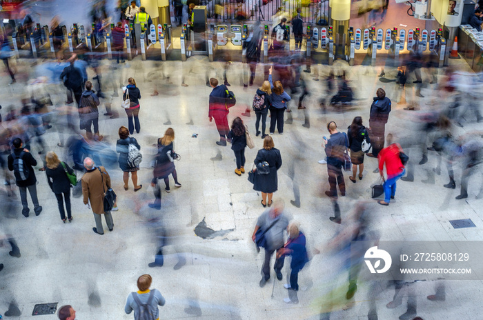 crowd of people at train station - commuters waiting - blurred motion