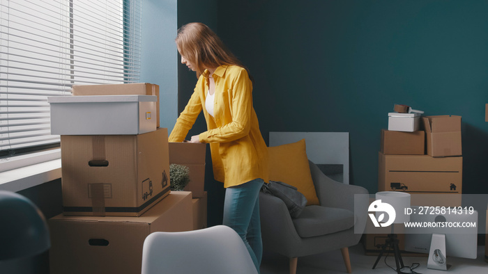 Woman moving in a new house