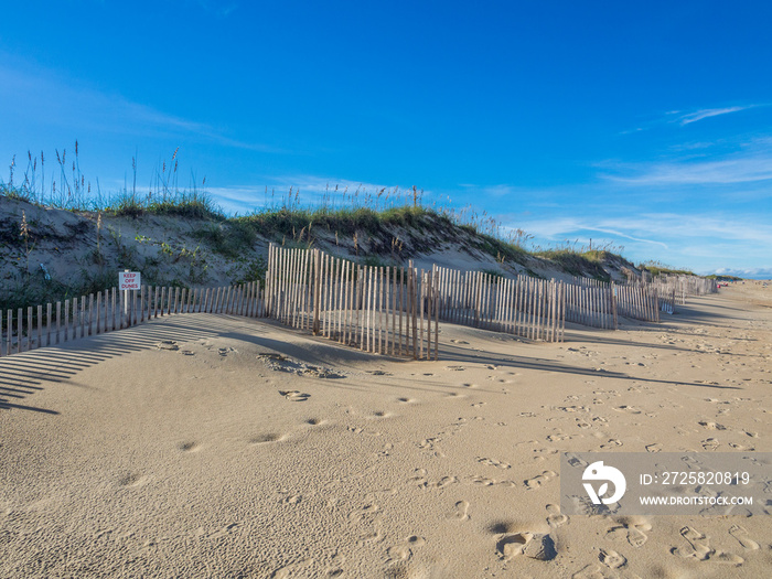 Wood fence at the sandy beach of Hatteras Island