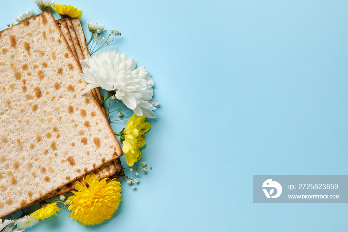 Jewish flatbread with flowers on color background