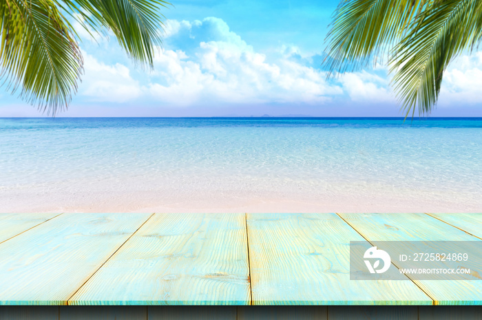 Wooden floor or plank on sand beach in summer. For product display.Calm Sea and Blue Sky Background.