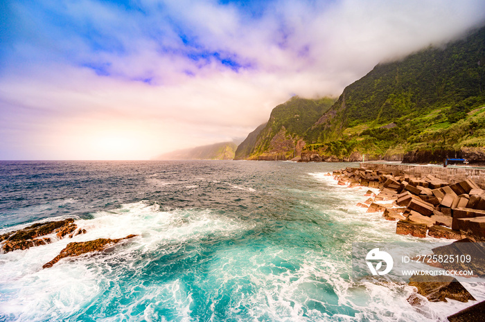 Beautiful wild coast scenery view with Bridal Veil Falls (Veu da noiva) at Ponta do Poiso in Madeira