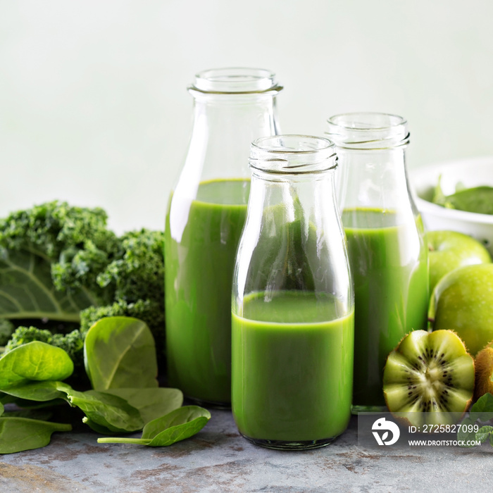 Green juice in glass bottles