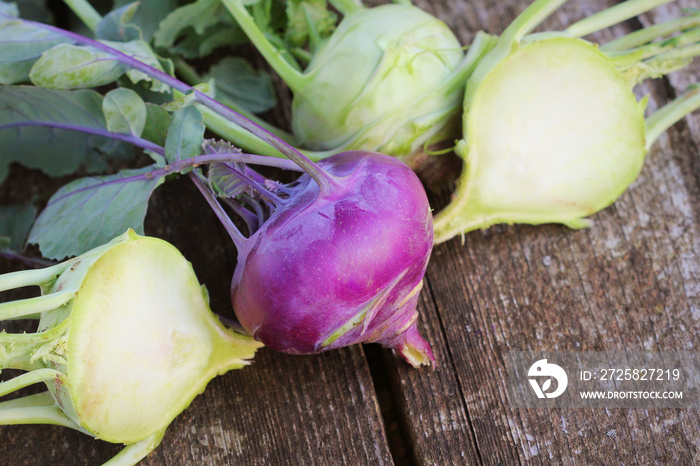 Fresh kohlrabi on the wooden table closeup