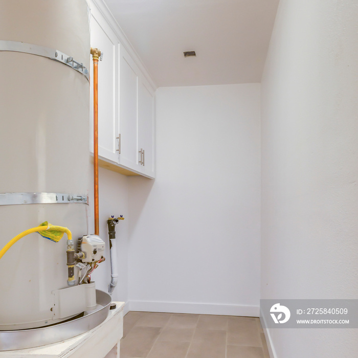 Square Water heater and laundary room in a home