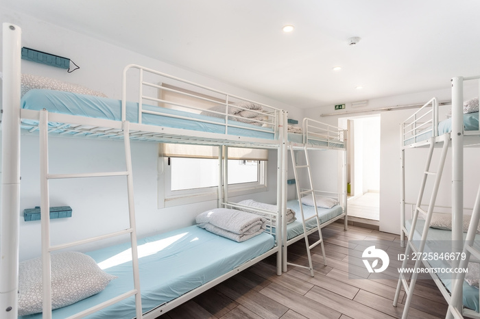 Clean bedroom with bunk beds in a hotel, a hostel for tourists.