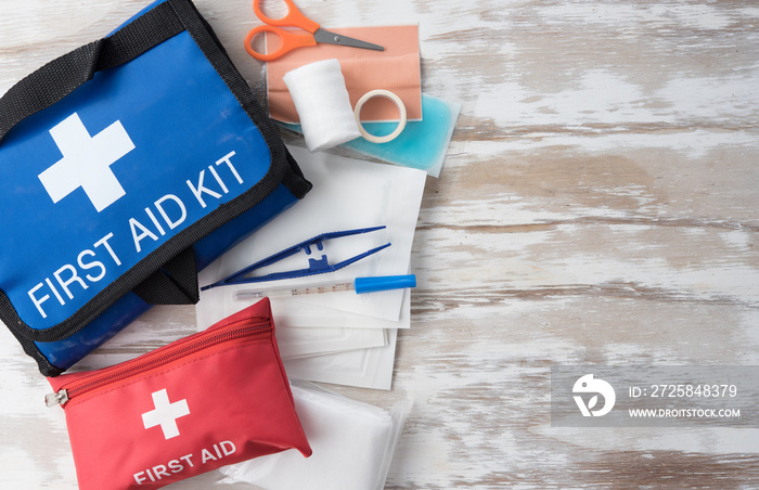 First aid medical kit on wood background,copy space,top view