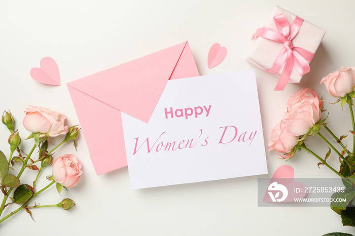 Concept of Happy Womens day with envelope, roses and gift box on white background