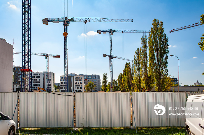 Many cranes on a construction site