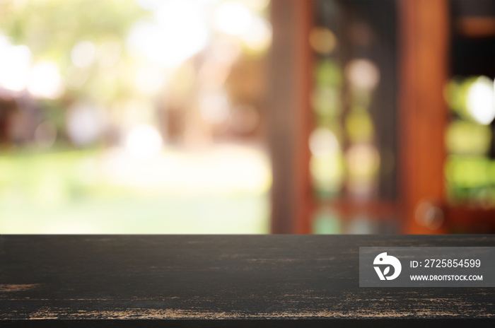 empty wood table with blur montage outdoor garden background