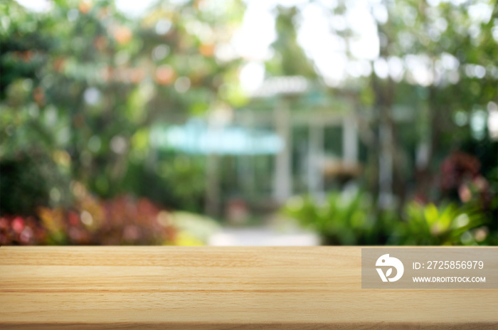 empty wood table over blurred outdoor cafe background