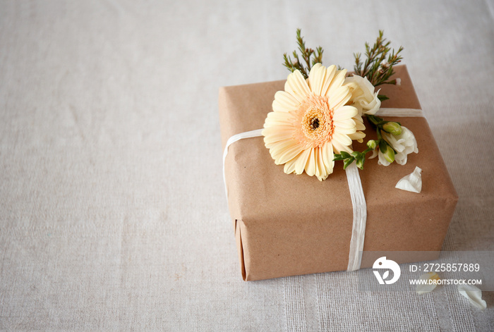 Handcrafted gift box with flowers on table