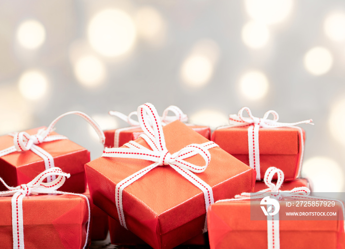 Red gift boxes on wooden table. Gift, present and celebration concept.