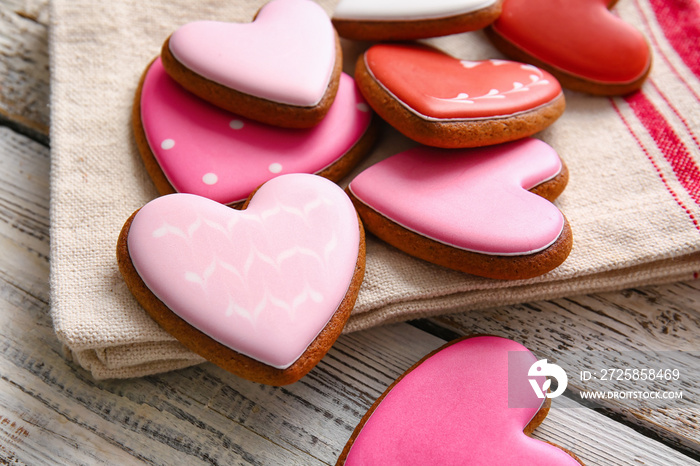 Tasty heart shaped cookies on white wooden background, closeup