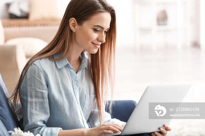 Young woman shopping online at home