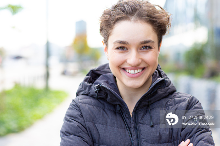 Portrait of a beautiful smiling young woman outdoors