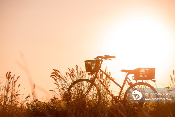 beautiful landscape image with Bicycle at sunset