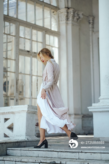 Girl is posing on the city street