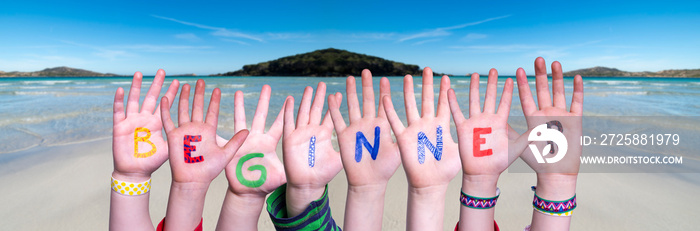 Children Hands Building Colorful English Word Beginner. Ocean And Beach As Background