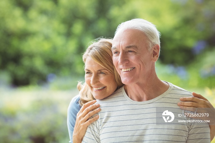 Senior couple embracing outdoors