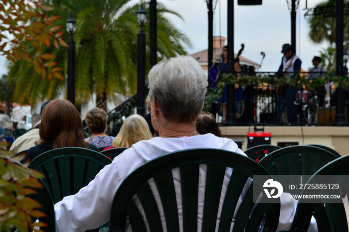 Retired Woman Sitting Alone at Concert in Retirement Community in Florida