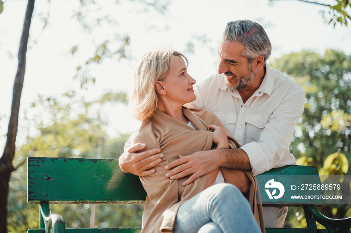 Relaxing,family,free time,age,tourism,travel and people concept.Senior couple hugging and Happy matu