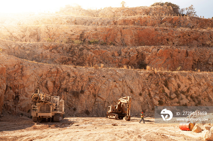 Miners working in dusty and baking hot.