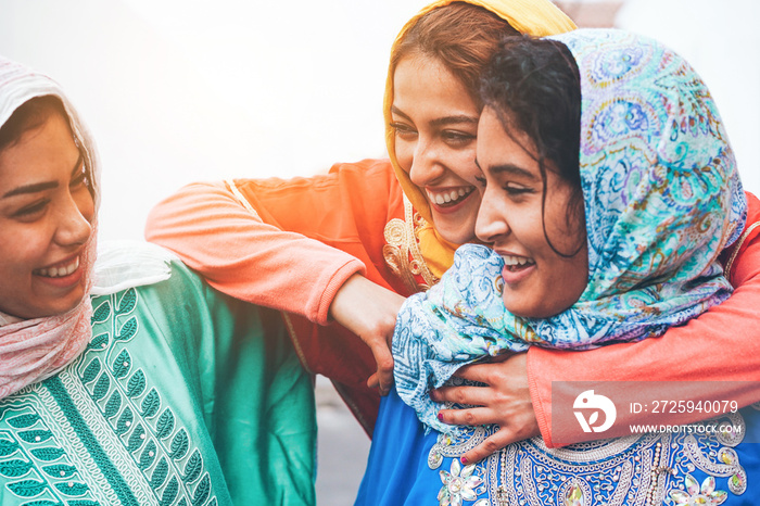 Young islamic friends having fun outdoor - Happy arabian friends laughing and smiling together - Fri