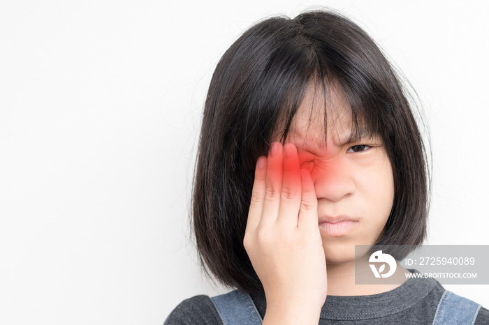 Conjunctivitis eye in child. Asia kid hand on her face as suffering from eye disease in childhood.