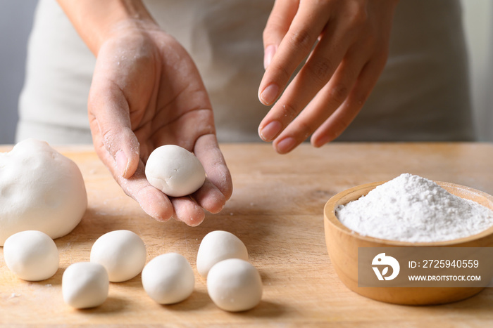 Hand making Tangyuan, Chinese dessert made of ball glutinous rice flour