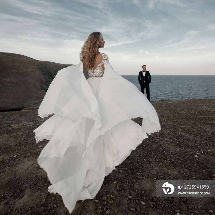 Fashion bride in beautiful wedding dress outdoor