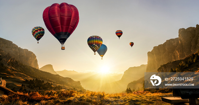 Beautiful panoramic nature landscape of countryside mountains with colorful high hot air balloons fe