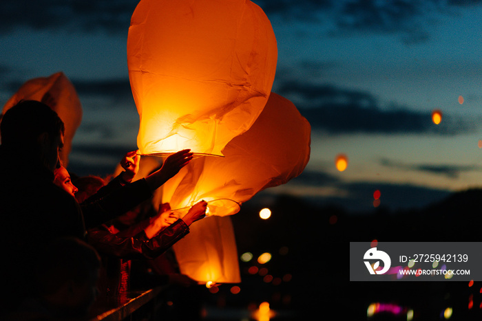 In the evening, at sunset, people with their relatives and friends launch traditional lanterns. Trad
