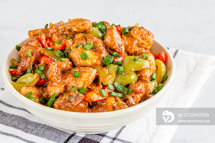 Sweet and Sour Chicken in a Bowl with Rice Close Up Photo. Popular American Chinese Food, American C